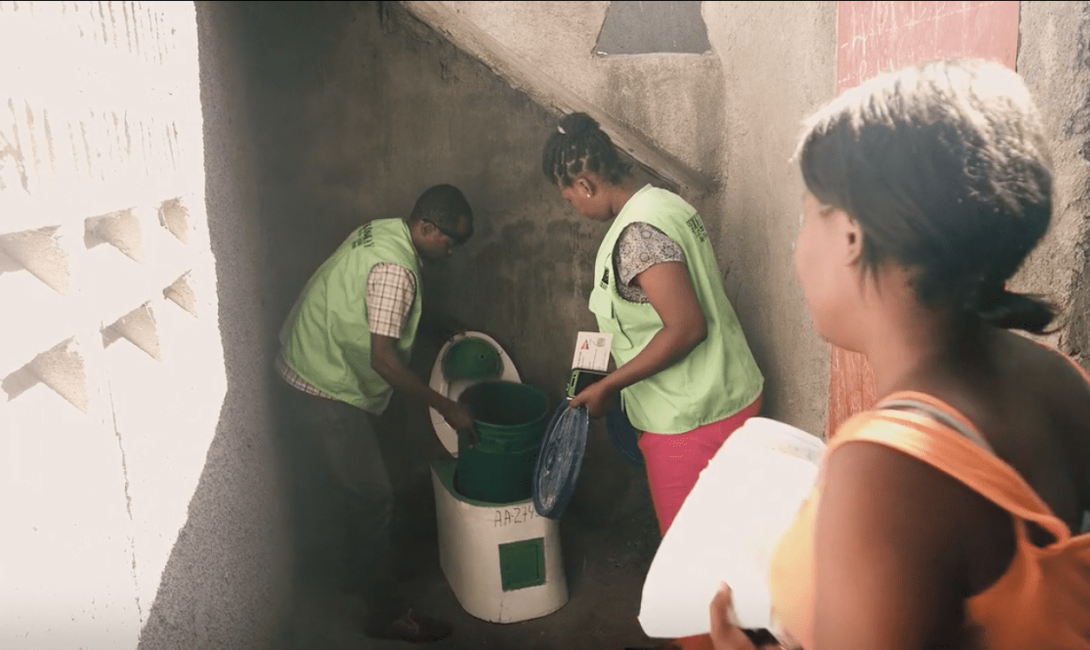 SOIL team installing EkoLakay toilet for client in Cap-Haitien. 