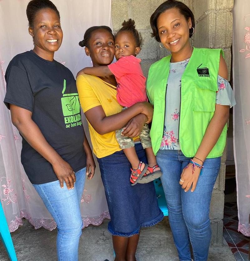 EkoLakay customer, Edeline La Fosse, with SOIL staff Carine Roberts and Algate Joseph